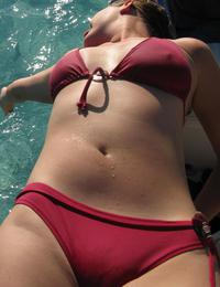 A bikini girl going topless on the La Joya Nude Image 1