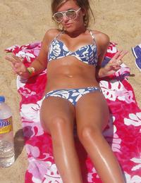 A bikini babe going topless on the Biarritz Image 3