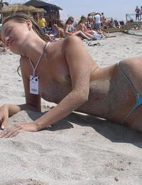 A bikini babe going topless on the Biarritz Image 8