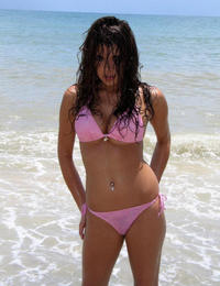 A busty bikini lady undressing on the Natadola Image 8