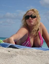 A busty bikini bitch undressing on the Trunk Bay Image 5