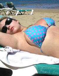 A busty bikini bitch undressing on the Trunk Bay Image 10