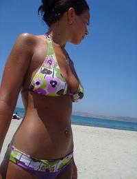 A girl removing her micro bikini at the Peka Peka Image 7