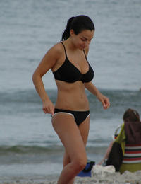 A busty bikini lady undressing on the Cancun Image 3