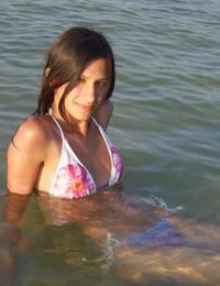 A busty bikini lady undressing on the Cancun Image 5
