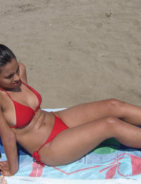 A busty bikini lady undressing on the Cancun Image 6