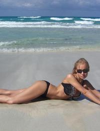 A bikini cutie going topless on the Waikiki Image 2