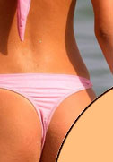 Beach girl in pink thongs